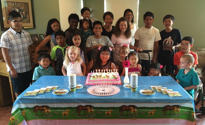 Surrounded by most of her siblings, nieces, and nephews