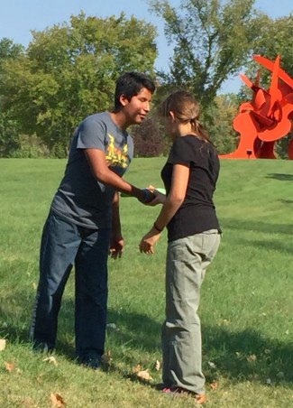 Carlin teaching Colin (who is blind) how to throw a Frisbee