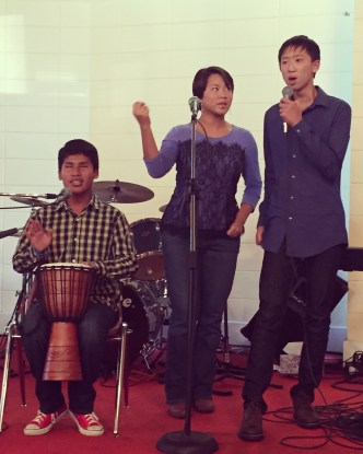 Three of the kids warming up before singing at Kingdom Life